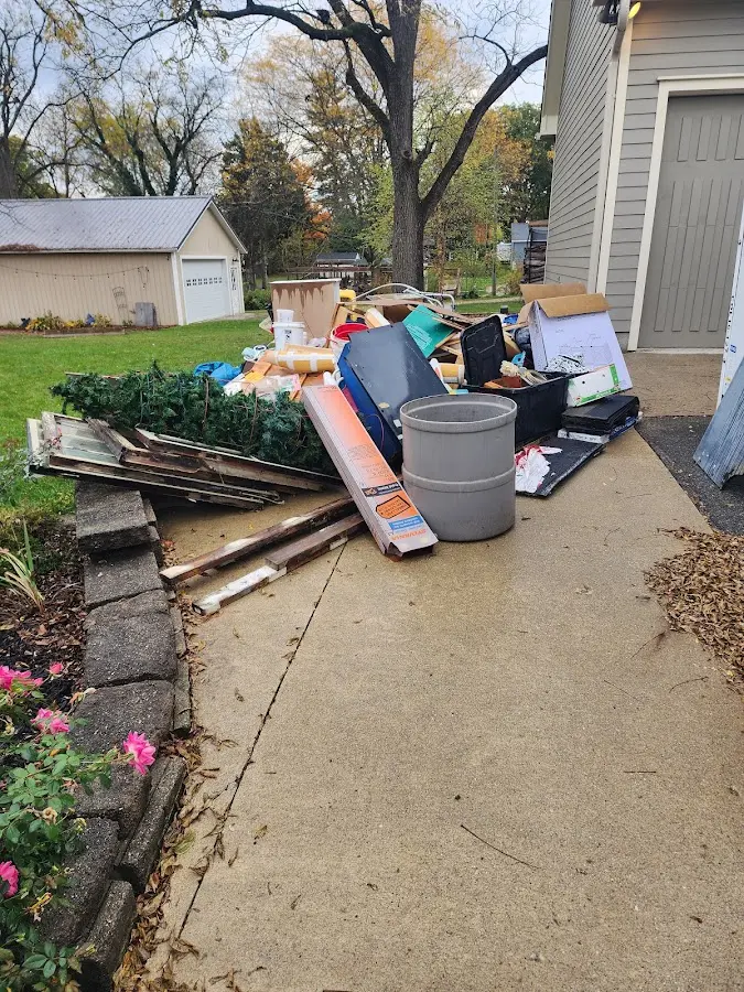 Dumpster being loaded with debris for 10 Yard Dumpster Rental in Valley Center
